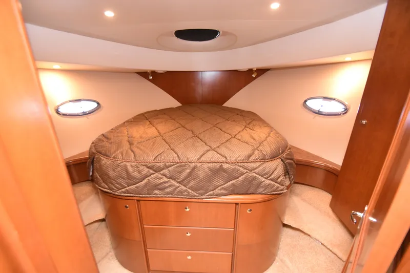 Slide: The Image of Luxurious cabin interior of 2007 Silverton 38 Convertible yacht with cozy bed. - 18