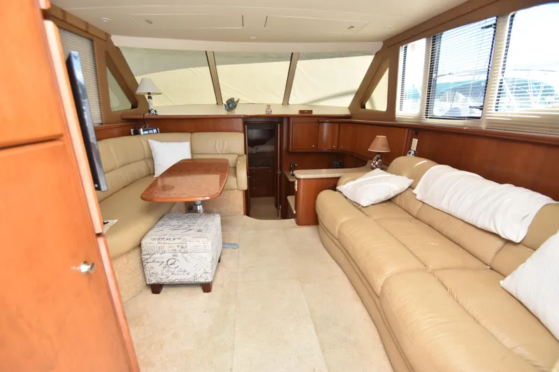 Slide: The Image of Luxurious interior of 2007 Silverton 38 Convertible yacht with beige leather seating. - 29