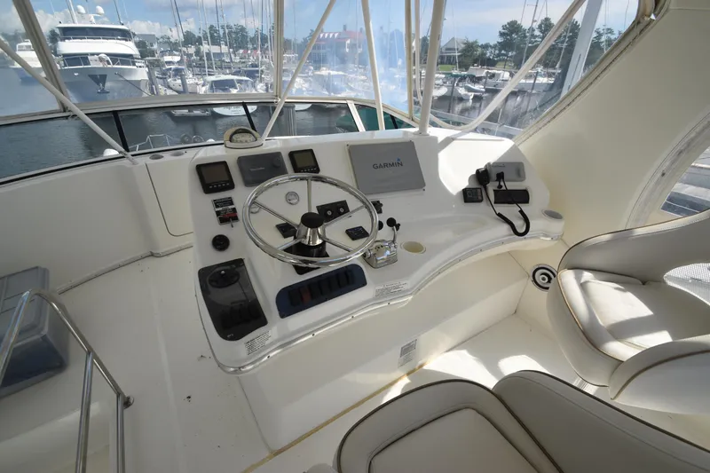 Slide: The Image of 2007 Silverton 38 Convertible yacht helm with steering wheel and navigation equipment. - 3
