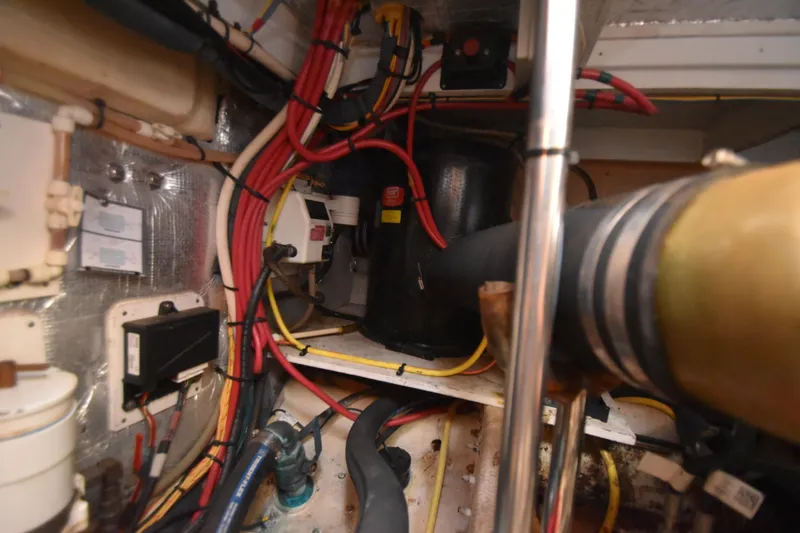 Slide: The Image of Engine room of 2007 Silverton 38 Convertible with wiring and mechanical components. - 34