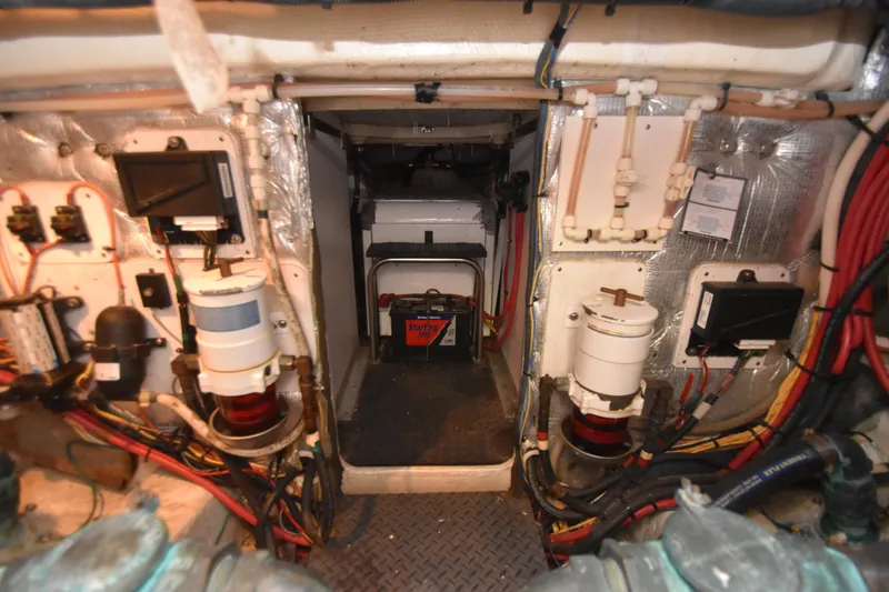 Slide: The Image of Engine room of a 2007 Silverton 38 Convertible boat, showcasing wiring and components. - 36