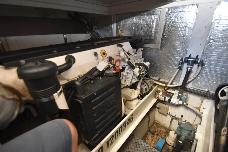 Slide: The Image of Engine room of 2007 Silverton 38 Convertible boat with visible components and wiring. - 37