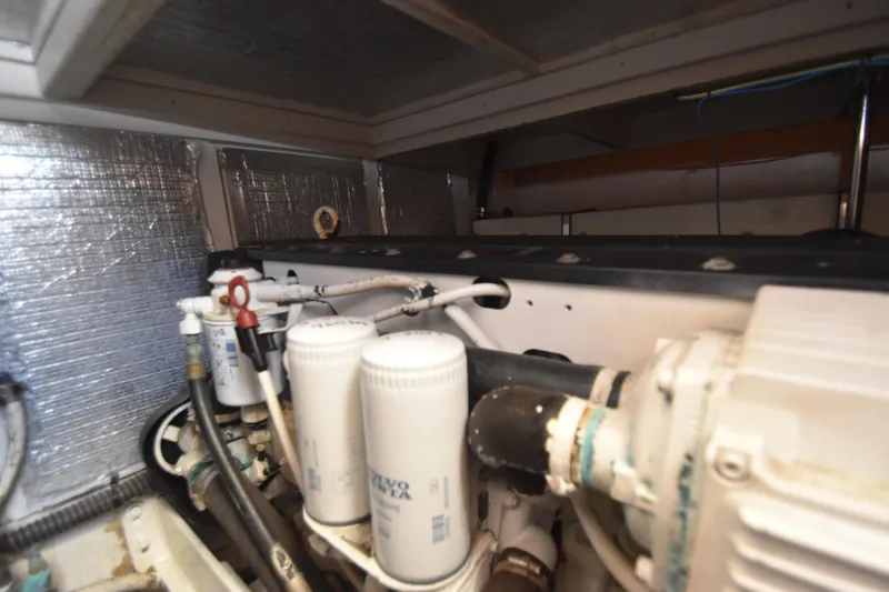 Slide: The Image of Engine room of a 2007 Silverton 38 Convertible boat, showing filters and components. - 38