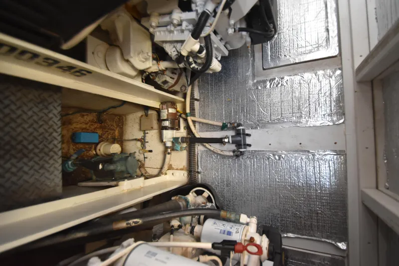 Slide: The Image of Engine room of 2007 Silverton 38 Convertible with visible mechanical components and insulation. - 39