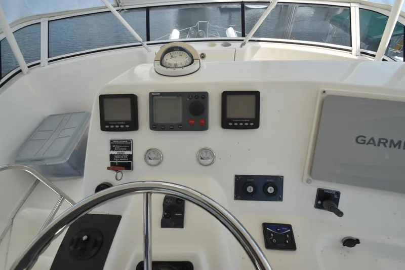 Slide: The Image of 2007 Silverton 38 Convertible helm with navigation instruments and steering wheel. - 7