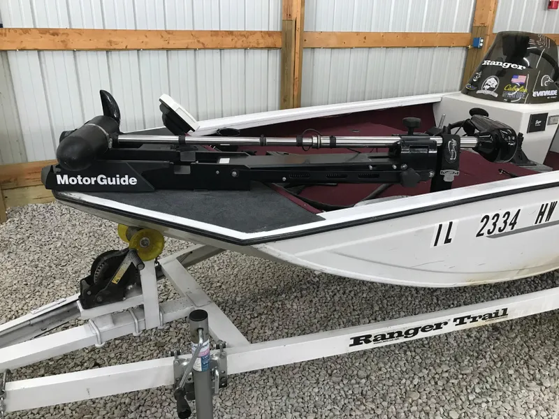 Slide: The Image of 1995 Ranger Cherokee 17' boat with MotorGuide trolling motor on trailer in garage. - 12