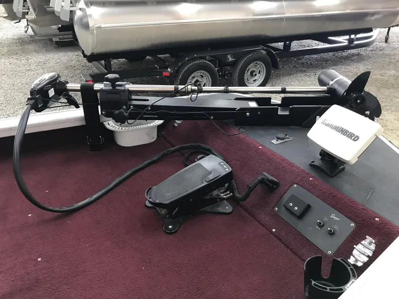 Slide: The Image of 1995 Ranger Cherokee 17' boat interior with trolling motor and Humminbird fish finder. - 9