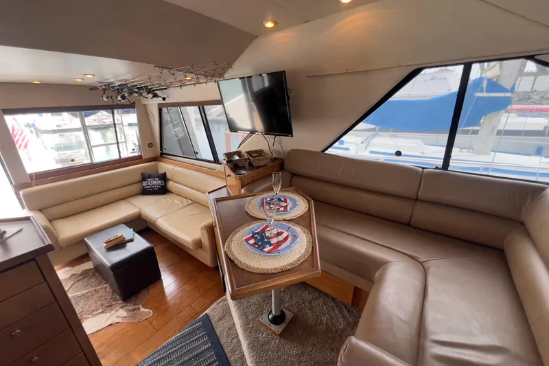 Slide: The Image of Luxurious interior of 1999 Bayliner 3988 Command Bridge Motoryacht with leather seating and modern amenities. - 22