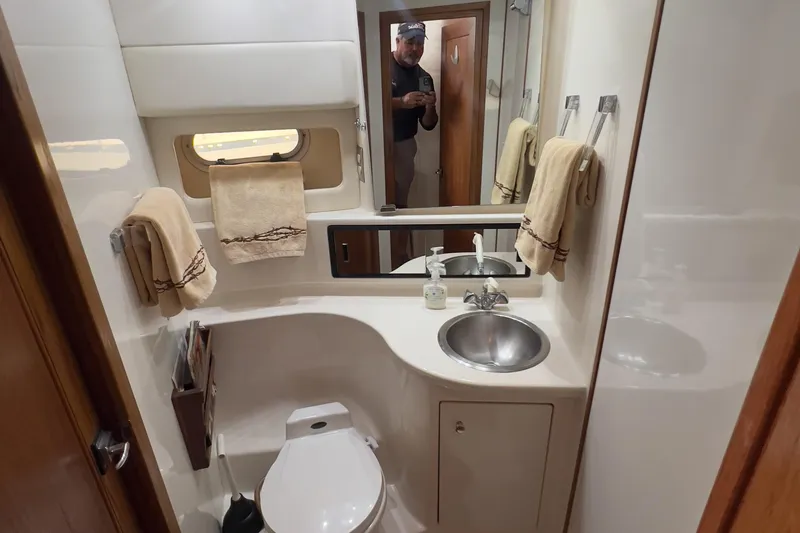 Slide: The Image of Bathroom interior of 1999 Bayliner 3988 Command Bridge Motoryacht with sink and toilet. - 29