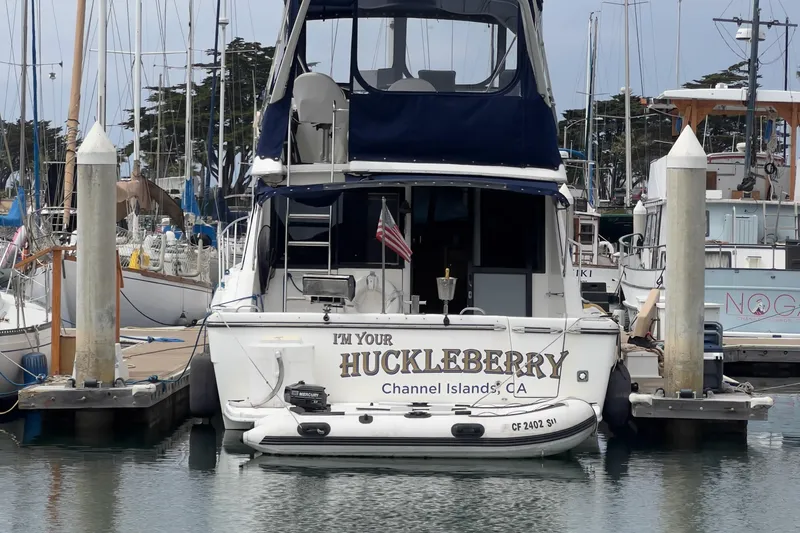 Slide: The Image of 1999 Bayliner 3988 Command Bridge Motoryacht docked, named "I'm Your Huckleberry," Channel Islands, CA. - 38