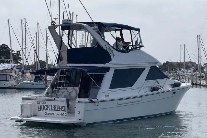 Slide: The Image of 1999 Bayliner 3988 Command Bridge Motoryacht docked in a marina, Channel Islands. - 43