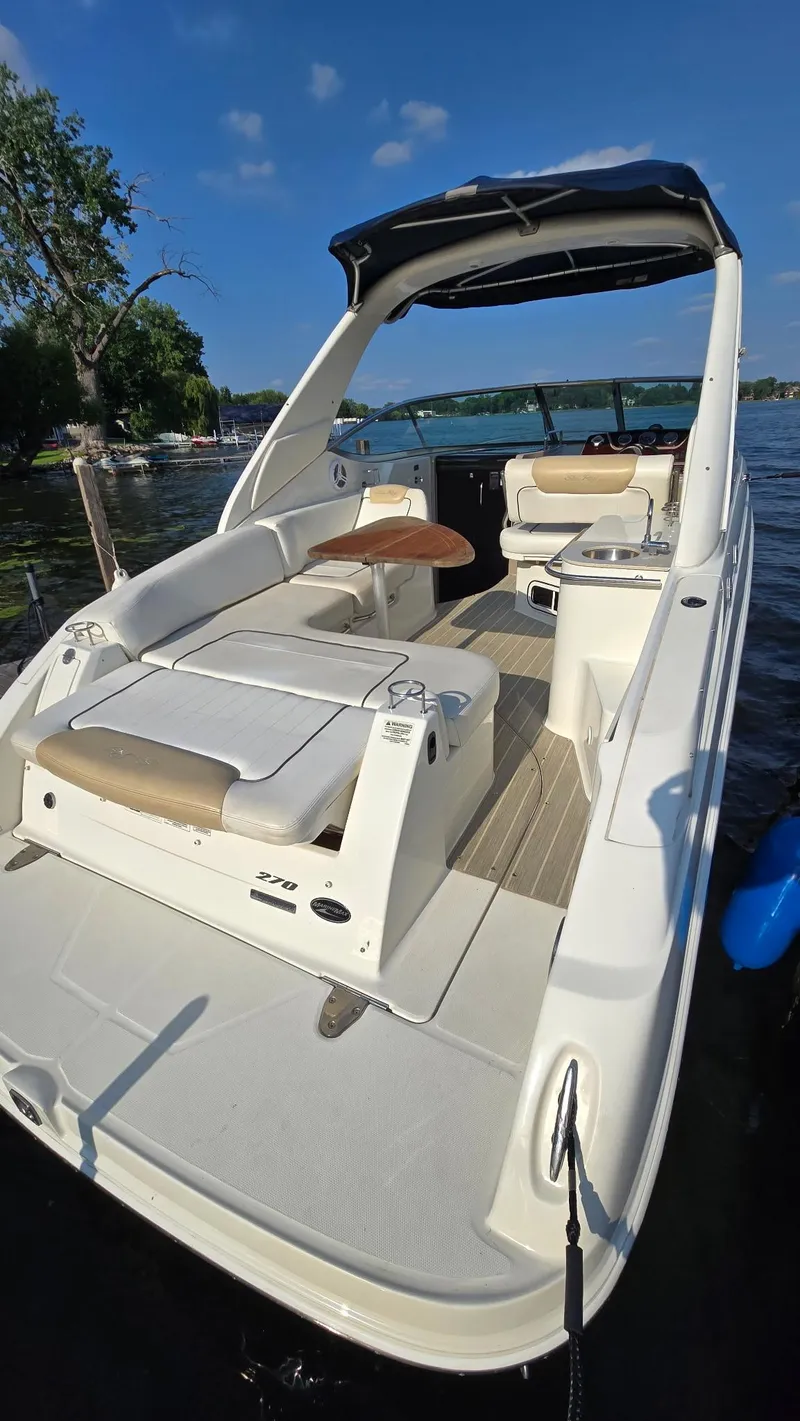 Slide: The Image of 2009 Sea Ray 270 Sundancer boat docked on a sunny day. - 5