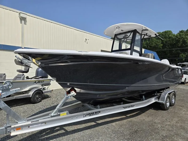 The Image of 2026 Sea Hunt Ultra 275 SE boat on trailer, parked outdoors. - 1