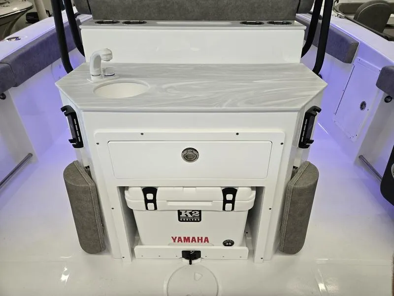 Slide: The Image of 2026 Sea Hunt Ultra 275 SE boat console with sink, storage, and Yamaha cooler. - 15