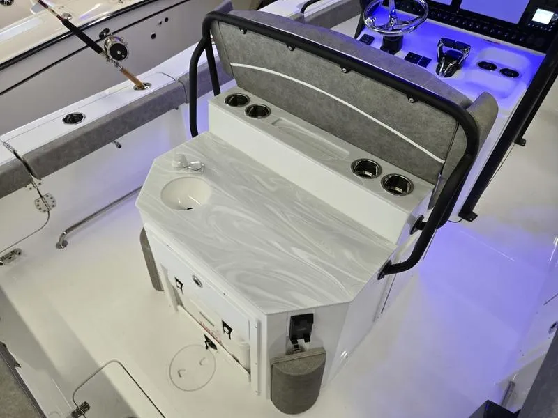 Slide: The Image of 2026 Sea Hunt Ultra 275 SE boat interior with seating and control panel. - 18
