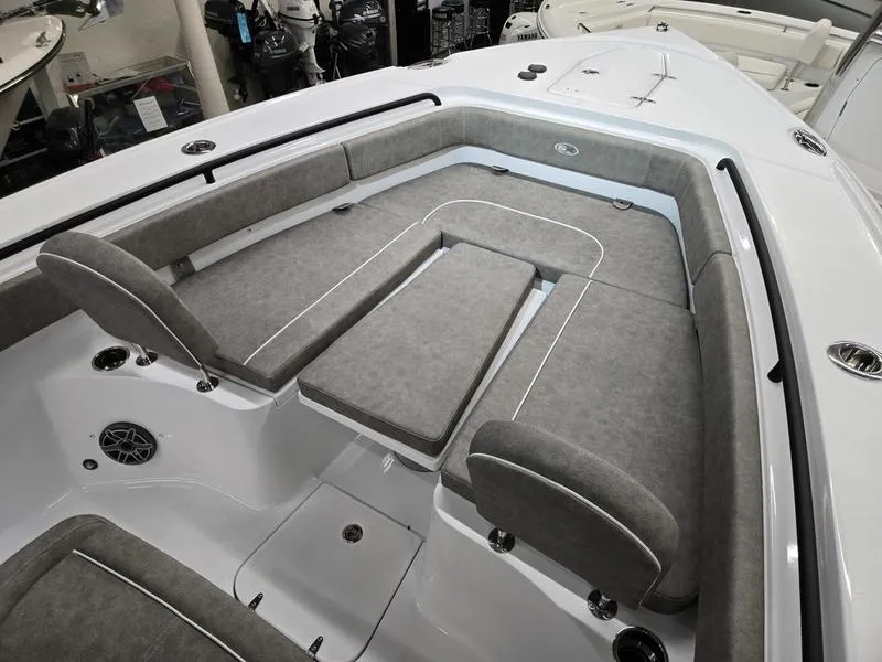 Slide: The Image of 2026 Sea Hunt Ultra 275 SE boat interior with gray cushioned seating and sleek design. - 4