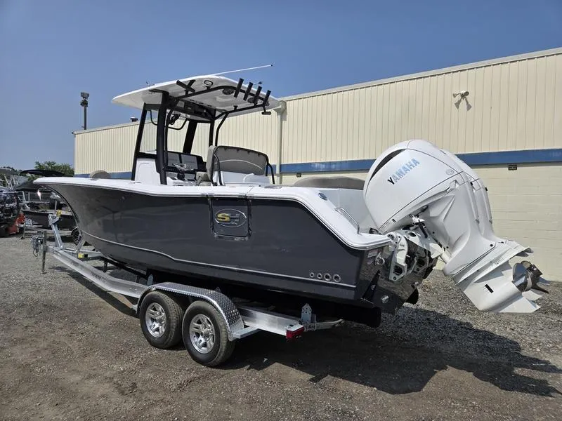 Slide: The Image of 2026 Sea Hunt Ultra 275 SE boat on trailer, featuring Yamaha outboard motor. - 5
