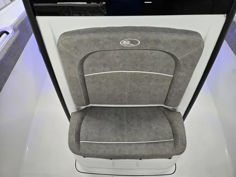 Slide: The Image of 2026 Sea Hunt Ultra 275 SE boat seat with gray upholstery and white accents. - 6