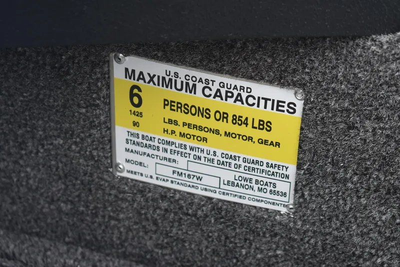 Slide: The Image of U.S. Coast Guard capacity label on 2025 Lowe FM 1675 WT boat, maximum 6 persons or 854 lbs. - 10