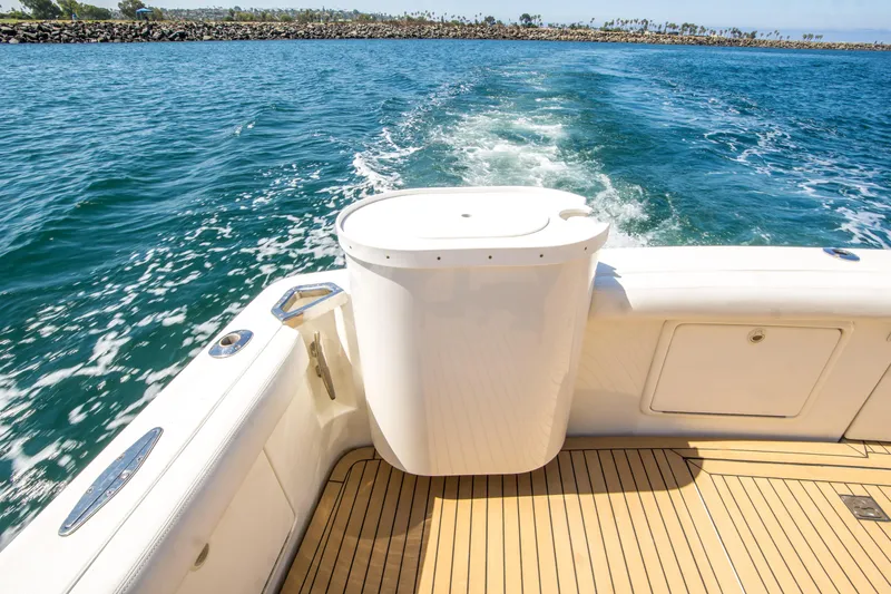 Slide: The Image of Riviera 43 Open Flybridge 1999 yacht deck with ocean view and teak flooring. - 15