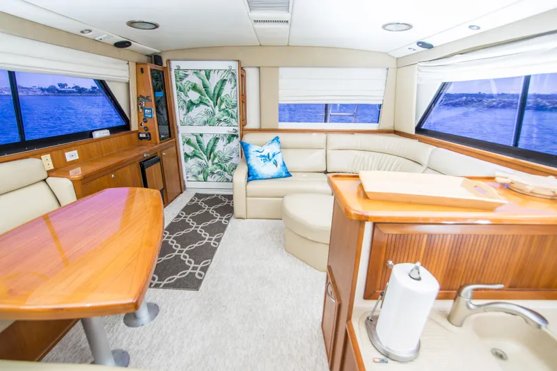 Slide: The Image of Luxurious interior of 1999 Riviera 43 Open Flybridge yacht with elegant seating and ocean views. - 17