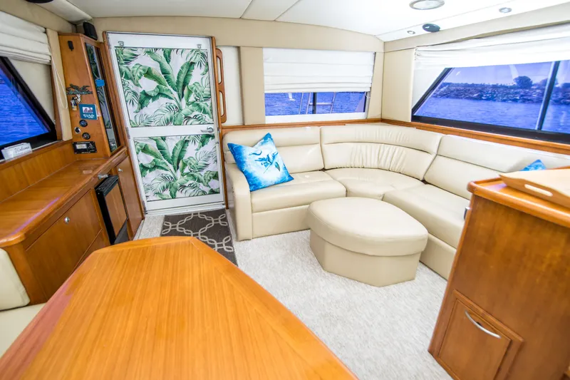 Slide: The Image of Luxurious interior of 1999 Riviera 43 Open Flybridge yacht with cream leather seating. - 18