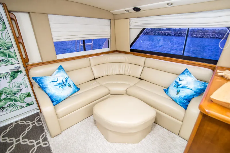 Slide: The Image of Luxurious interior of 1999 Riviera 43 Open Flybridge with cream leather seating and ocean view. - 19