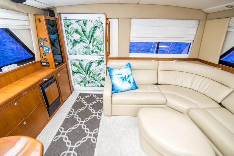 Slide: The Image of Luxurious interior of 1999 Riviera 43 Open Flybridge yacht with leather seating and tropical decor. - 20
