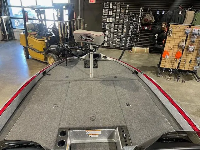 Slide: The Image of 2023 Triton 20 TRX Patriot boat interior in showroom with equipment display. - 14