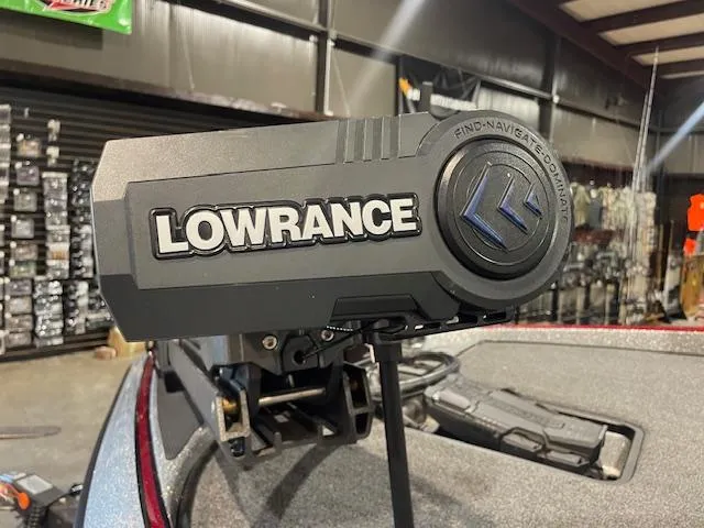 Slide: The Image of Lowrance device on 2023 Triton 20 TRX Patriot boat in a showroom setting. - 5