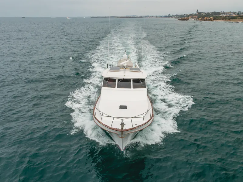 Slide: The Image of 1984 Vic Franck pilothouse yacht cruising on open sea, aerial view. - 15