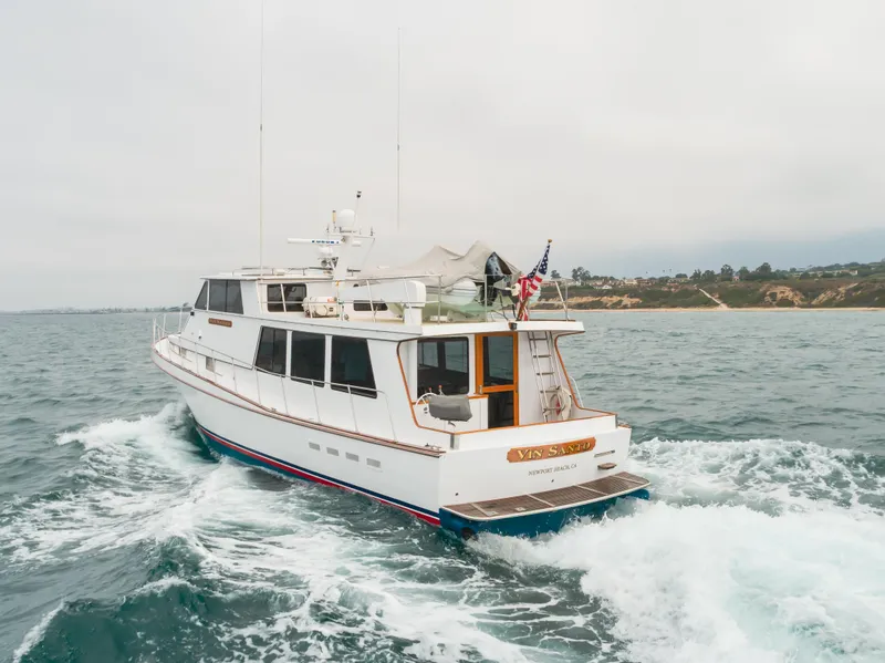 Slide: The Image of 1984 Vic Franck pilothouse yacht cruising on open water, rear view. - 19