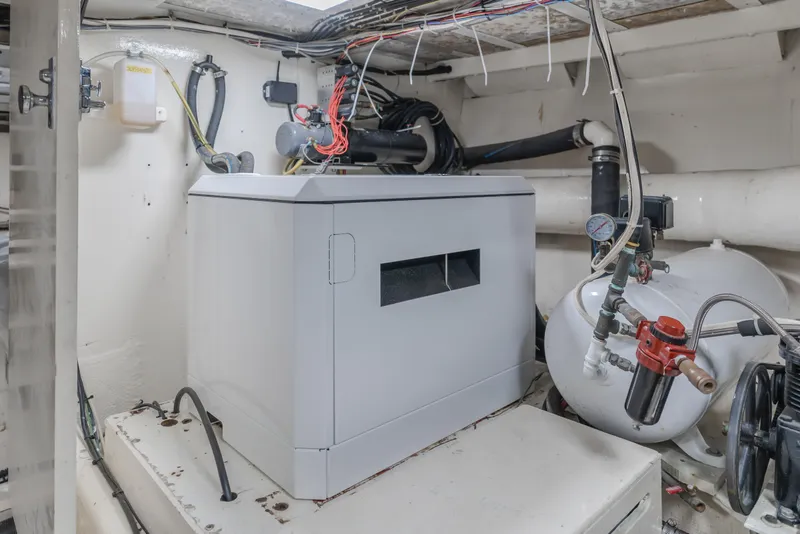 Slide: The Image of Engine room of 1984 Vic Franck pilothouse with machinery and wiring. - 27