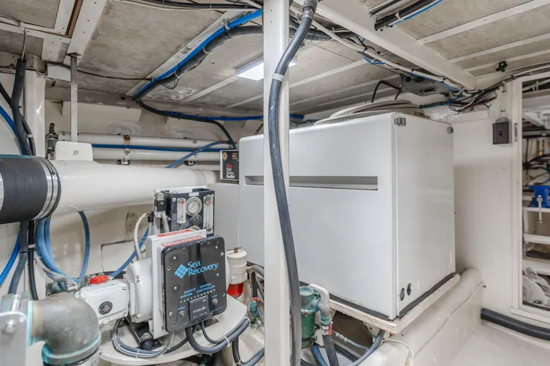 Slide: The Image of Engine room of 1984 Vic Franck pilothouse with Sea Recovery system and piping. - 28