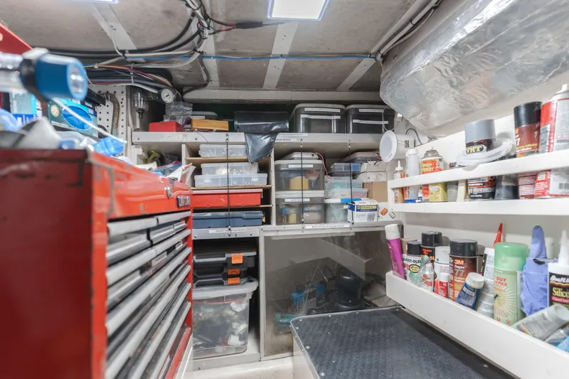 Slide: The Image of Workshop area inside a 1984 Vic Franck pilothouse, featuring organized tools and supplies. - 31