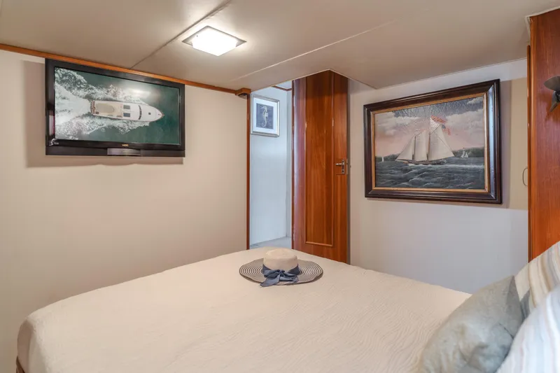 Slide: The Image of Cozy bedroom in 1984 Vic Franck pilothouse with nautical decor and wall art. - 33