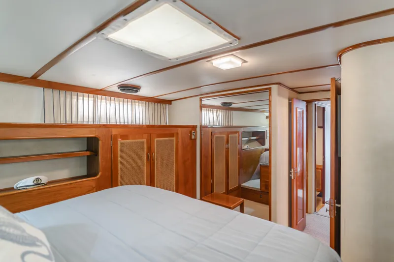 Slide: The Image of Luxurious 1984 Vic Franck pilothouse interior with wood paneling and cozy sleeping quarters. - 37