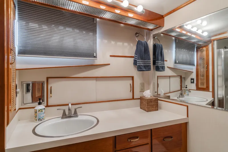 Slide: The Image of 1984 Vic Franck pilothouse bathroom with modern fixtures, wooden accents, and ample lighting. - 38