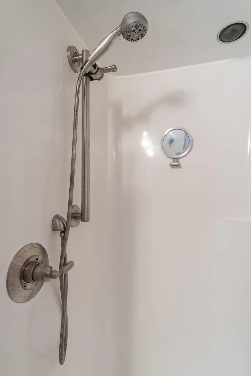Slide: The Image of Shower area in 1984 Vic Franck pilothouse with handheld showerhead and control valve. - 41