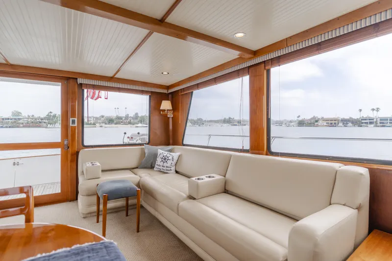 Slide: The Image of Luxurious 1984 Vic Franck pilothouse interior with beige seating and panoramic windows. - 45