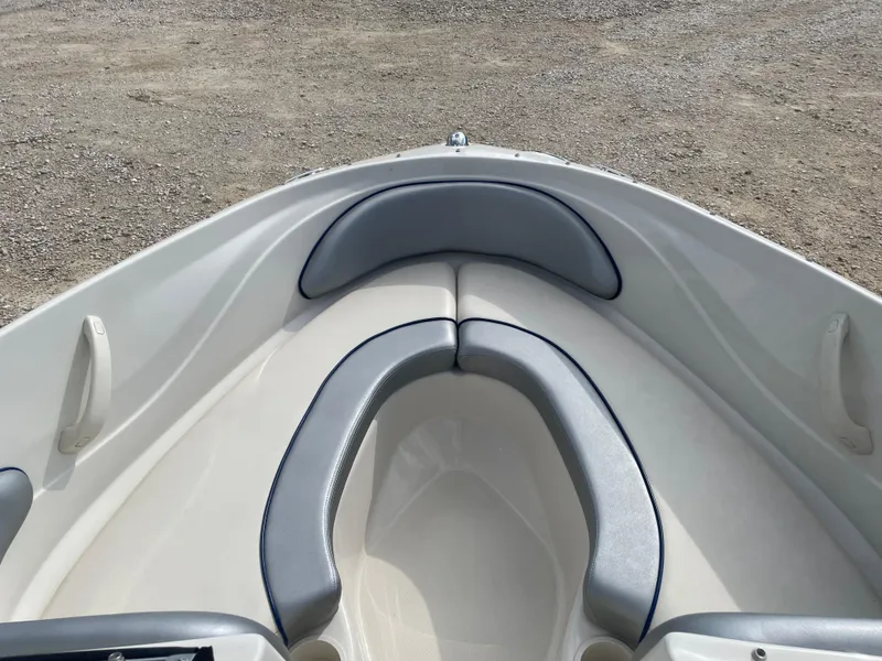 Slide: The Image of 2009 Sea Ray 175 Sport boat interior with gray cushioned seating. - 10