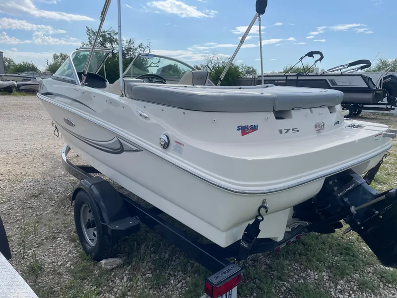 Slide: The Image of 2009 Sea Ray 175 Sport boat on trailer, parked outdoors under a clear sky. - 5