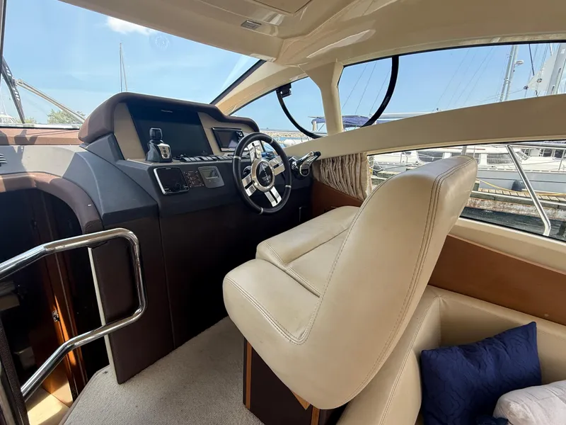 Slide: The Image of Interior of 2018 Azimut 42 Fly yacht showing helm and seating area. - 10