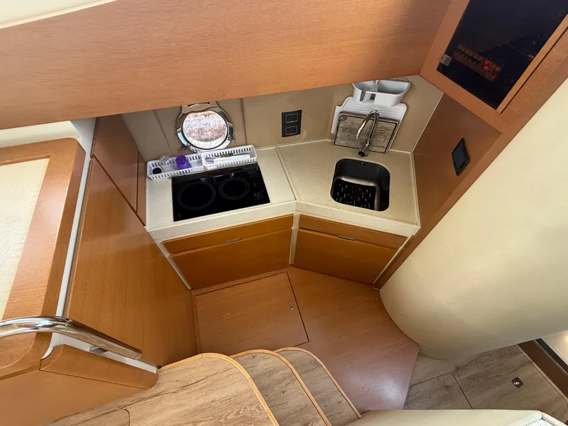 Slide: The Image of Compact kitchen area in 2018 Azimut 42 Fly yacht with stove and sink. - 13