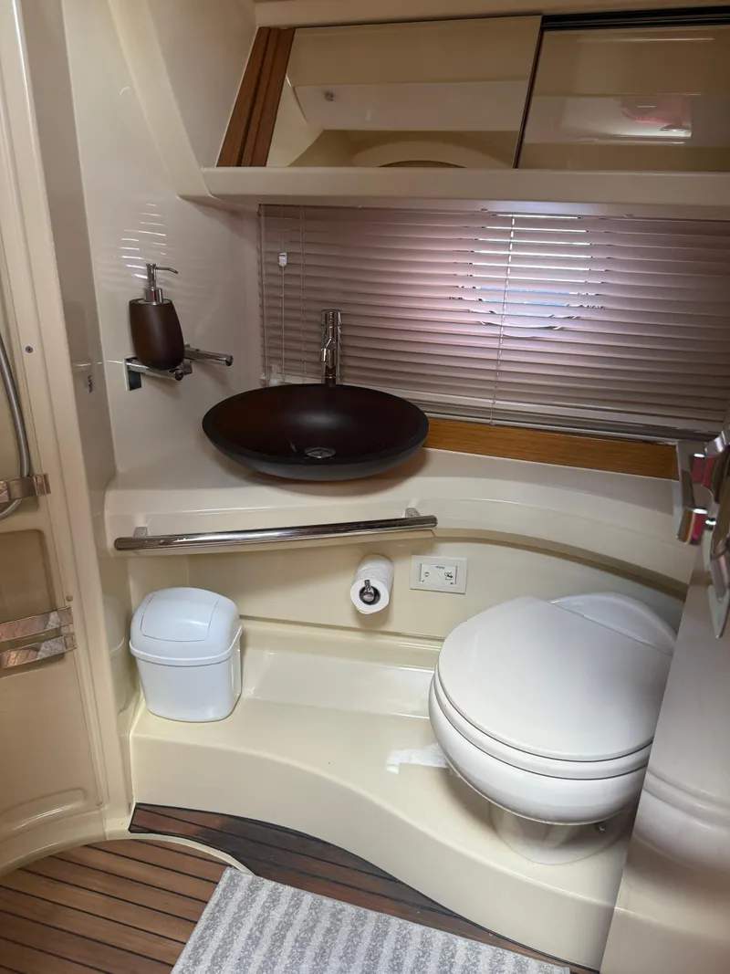 Slide: The Image of Luxurious bathroom in 2018 Azimut 42 Fly yacht with modern fixtures and wooden accents. - 14
