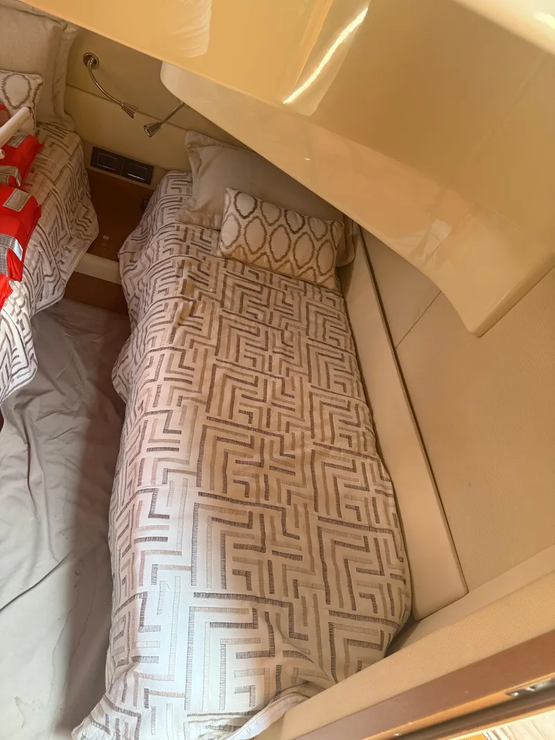 Slide: The Image of Cabin interior of 2018 Azimut 42 Fly yacht with patterned bedding. - 17