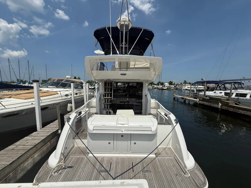 Slide: The Image of Azimut 42 Fly 2018 yacht docked at marina, rear view with clear sky. - 2