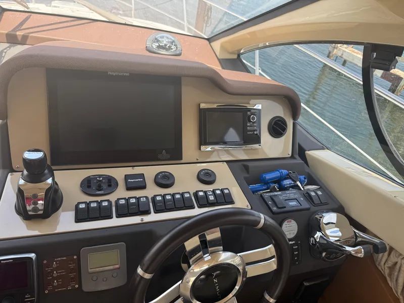 Slide: The Image of Cockpit of 2018 Azimut 42 Fly yacht with navigation controls and steering wheel. - 21