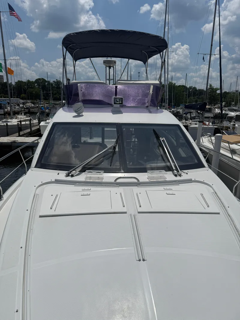 Slide: The Image of 2018 Azimut 42 Fly yacht docked at marina under cloudy sky. - 24