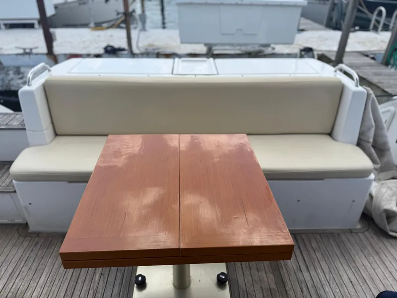Slide: The Image of Azimut 42 Fly 2018 yacht interior with wooden table and cushioned seating. - 36